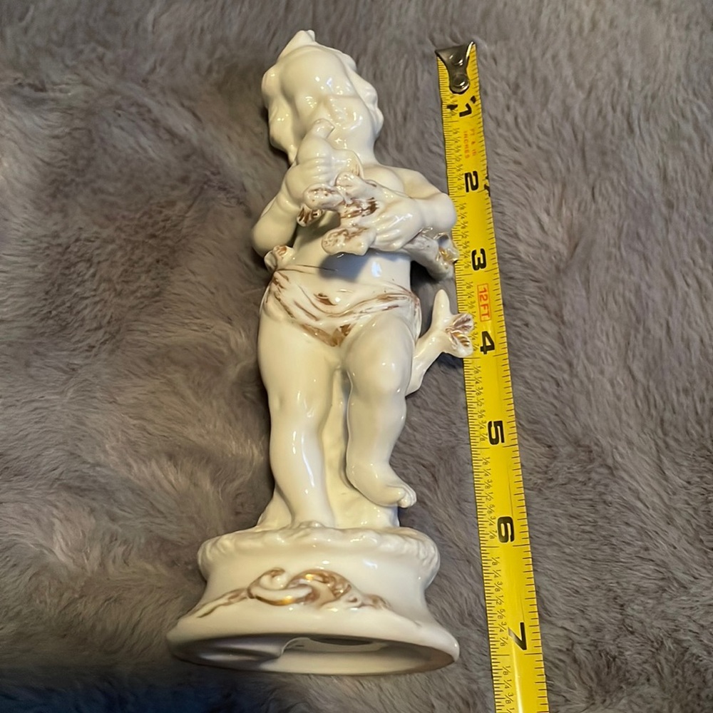 Porcelain Vintage cherub with bird and wood in hands with gold trimming #7223